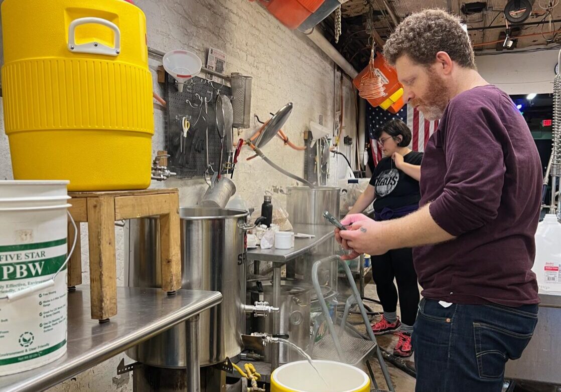 Photo of two CHAOS members brewing in our club brewhouse.